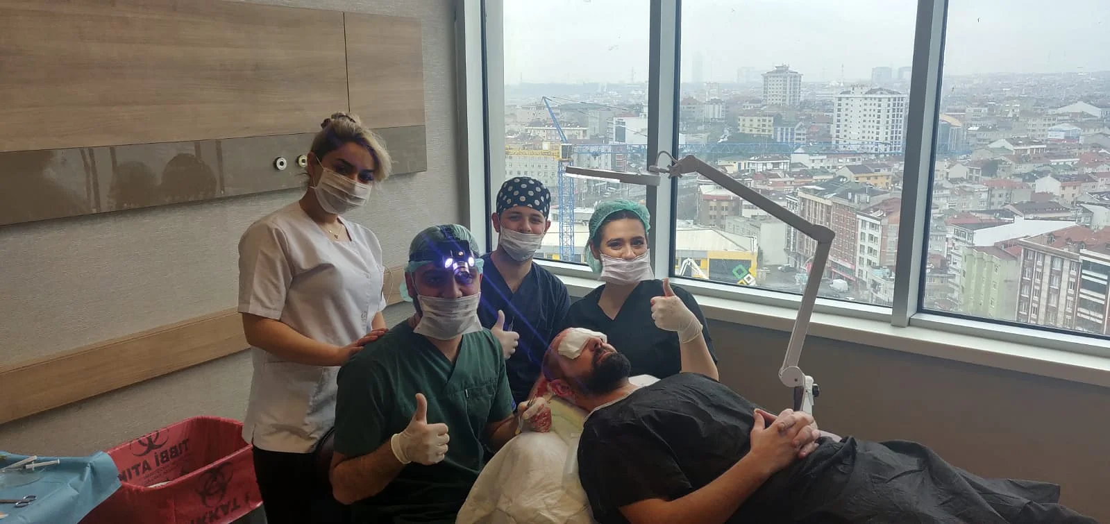 Istanbul medical team together in a hair transplant treatment room